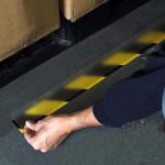 Self-adhesive protective tape for floor markings