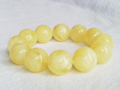 Amber bracelets, white color